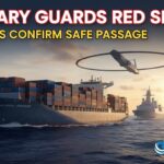 Naval warship escorting a large container vessel through the Red Sea waters